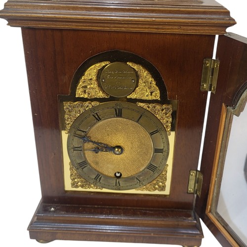 408 - THOMAS FRODSHAM, LONDON, A 20TH CENTURY WALNUT BRACKET CLOCK
Having a single carry handle, arched br... 