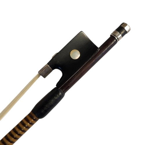 151A - A 19TH/20TH CENTURY VIOLIN BOW
The silver mounted octagonal stick, with ebony frog and mother of pea... 