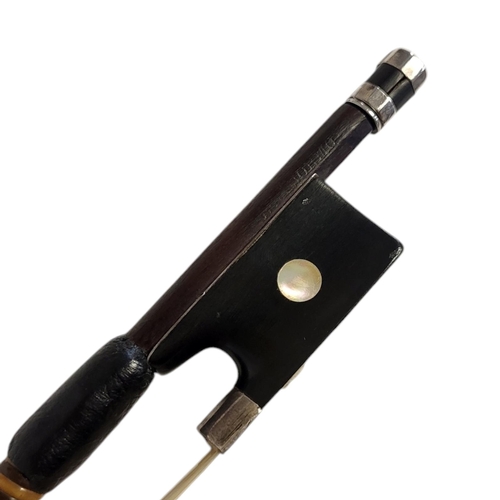 151A - A 19TH/20TH CENTURY VIOLIN BOW
The silver mounted octagonal stick, with ebony frog and mother of pea... 