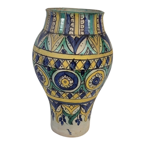 104 - A LATE 19TH CENTURY PERSIAN IZNIK STYLE FAIENCE EARTHENWARE ARABESQUE VASE
Overglaze painted with sy... 