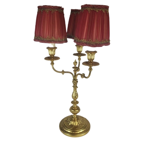 134 - AN EARLY 20TH CENTURY GILT BRASS CANDELABRA
Three branch arms with fine embossed acanthus leaf decor... 