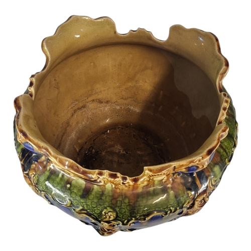 137 - A LARGE VICTORIAN MAJOLICA POTTERY JARDINIÈRE
Having a scrolled edge and embossed decoration, marked... 