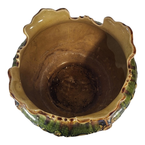 137 - A LARGE VICTORIAN MAJOLICA POTTERY JARDINIÈRE
Having a scrolled edge and embossed decoration, marked... 