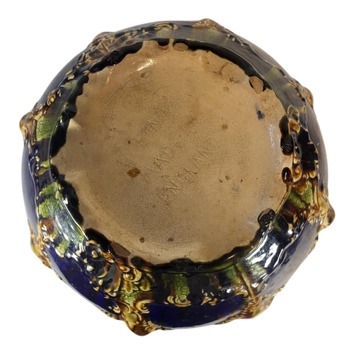 137 - A LARGE VICTORIAN MAJOLICA POTTERY JARDINIÈRE
Having a scrolled edge and embossed decoration, marked... 