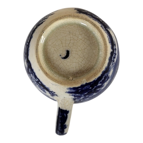 141 - AN 18TH CENTURY CAUGHLEY OF SHROPSHIRE BLUE AND WHITE CUSTARD CUP, CIRCA 1780
In Chinoiserie Pavilio... 