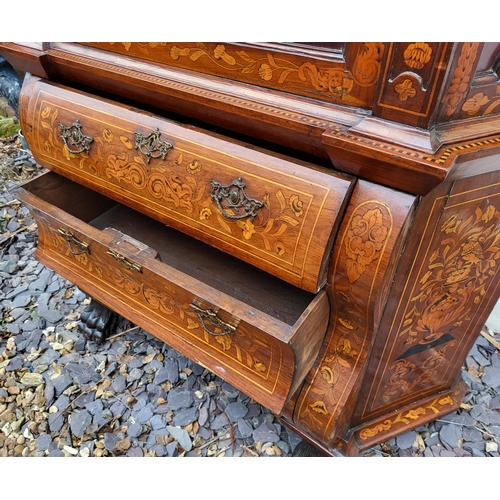 301 - A 19TH CENTURY DUTCH WALNUT AND FLORAL MARQUETRY INLAID DISPLAY CABINET ON BOMBE CHEST
The central c... 