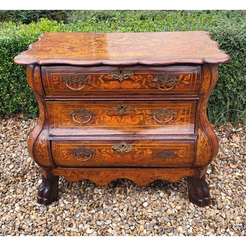 302 - A 19TH CENTURY DUTCH WALNUT AND FLORAL MARQUETRY INLAID BOMBE CHEST
The cartouche top above three lo... 