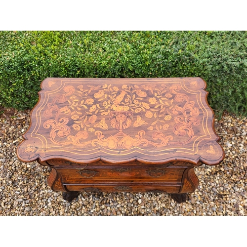 302 - A 19TH CENTURY DUTCH WALNUT AND FLORAL MARQUETRY INLAID BOMBE CHEST
The cartouche top above three lo... 