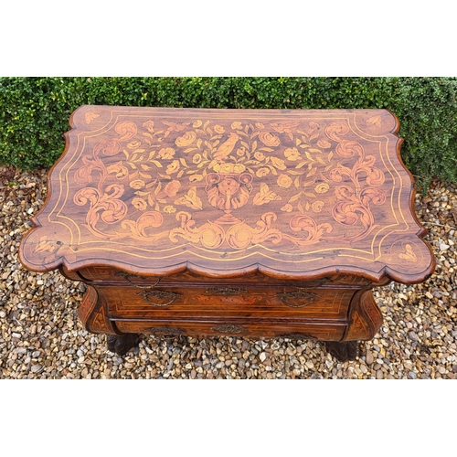 302 - A 19TH CENTURY DUTCH WALNUT AND FLORAL MARQUETRY INLAID BOMBE CHEST
The cartouche top above three lo... 