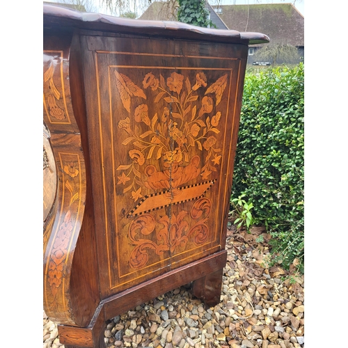 302 - A 19TH CENTURY DUTCH WALNUT AND FLORAL MARQUETRY INLAID BOMBE CHEST
The cartouche top above three lo... 