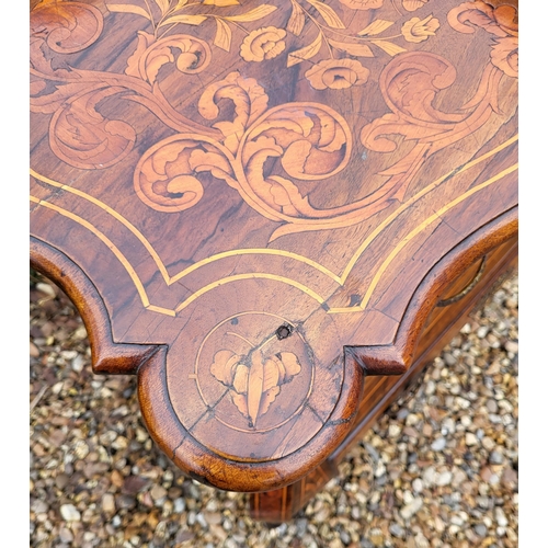 302 - A 19TH CENTURY DUTCH WALNUT AND FLORAL MARQUETRY INLAID BOMBE CHEST
The cartouche top above three lo... 