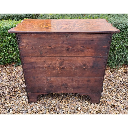 302 - A 19TH CENTURY DUTCH WALNUT AND FLORAL MARQUETRY INLAID BOMBE CHEST
The cartouche top above three lo... 