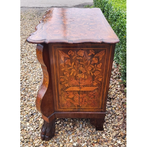 302 - A 19TH CENTURY DUTCH WALNUT AND FLORAL MARQUETRY INLAID BOMBE CHEST
The cartouche top above three lo... 