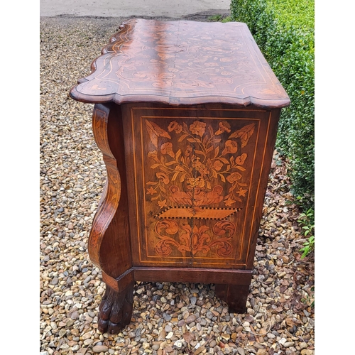 302 - A 19TH CENTURY DUTCH WALNUT AND FLORAL MARQUETRY INLAID BOMBE CHEST
The cartouche top above three lo... 