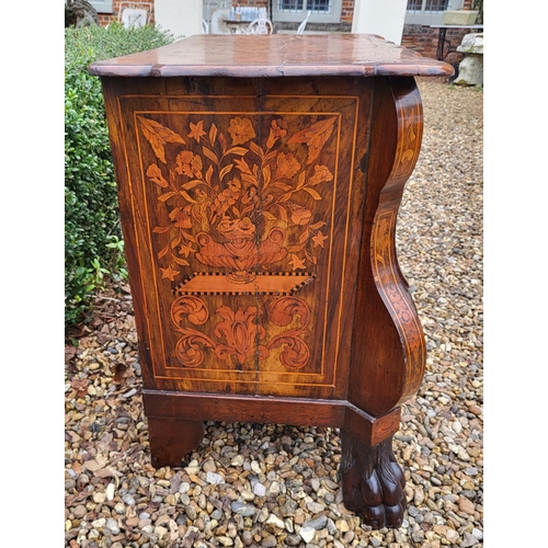 302 - A 19TH CENTURY DUTCH WALNUT AND FLORAL MARQUETRY INLAID BOMBE CHEST
The cartouche top above three lo... 