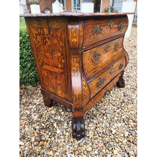 302 - A 19TH CENTURY DUTCH WALNUT AND FLORAL MARQUETRY INLAID BOMBE CHEST
The cartouche top above three lo... 