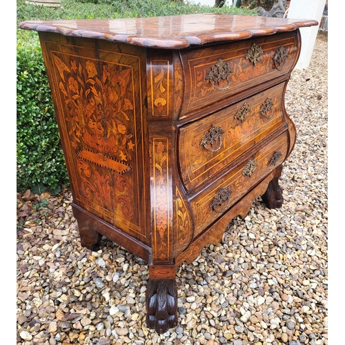 302 - A 19TH CENTURY DUTCH WALNUT AND FLORAL MARQUETRY INLAID BOMBE CHEST
The cartouche top above three lo... 