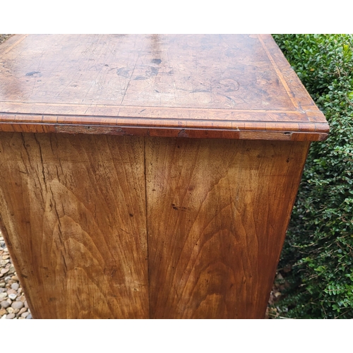 305 - AN 18TH CENTURY BURR WALNUT KNEEHOLE DESK
With an arrangement of seven drawers and central cupboard,... 