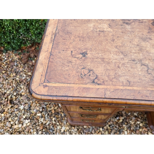 305 - AN 18TH CENTURY BURR WALNUT KNEEHOLE DESK
With an arrangement of seven drawers and central cupboard,... 