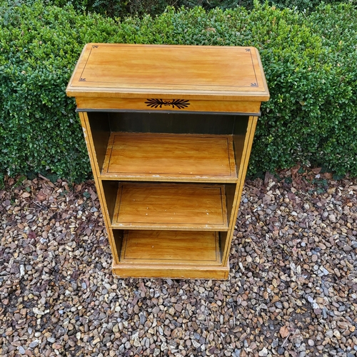 308 - A FAUX SATINWOOD PAINTED FLOOR STANDING OPEN BOOKCASE 
Along with a mahogany bedside cabinet, a maho... 