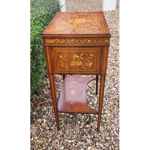 309 - A 19TH CENTURY DUTCH WALNUT AND FLORAL MARQUETRY INLAID LADIES’ WORK TABLE
With rise and fall top ab... 