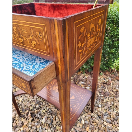 309 - A 19TH CENTURY DUTCH WALNUT AND FLORAL MARQUETRY INLAID LADIES’ WORK TABLE
With rise and fall top ab... 