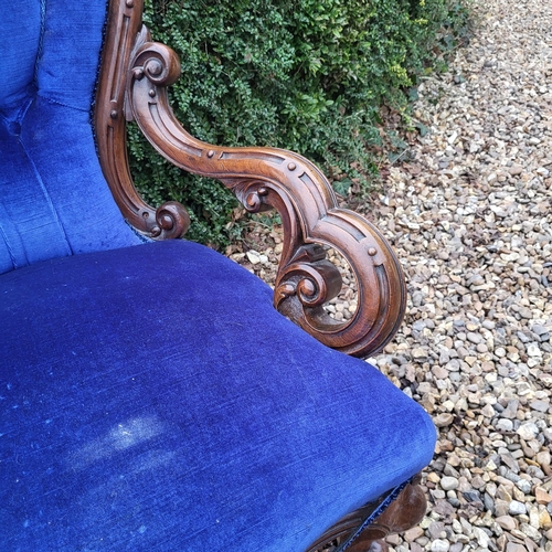 310 - A VICTORIAN MAHOGANY OPEN ARMCHAIR
With shell back overscroll carved and pieced arms, in royal blue ... 