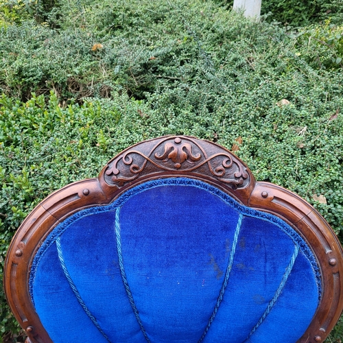 310 - A VICTORIAN MAHOGANY OPEN ARMCHAIR
With shell back overscroll carved and pieced arms, in royal blue ... 