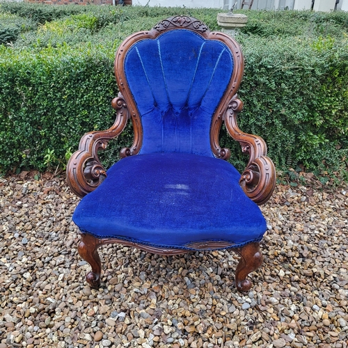 310 - A VICTORIAN MAHOGANY OPEN ARMCHAIR
With shell back overscroll carved and pieced arms, in royal blue ... 