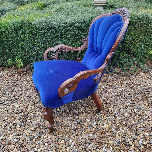 310 - A VICTORIAN MAHOGANY OPEN ARMCHAIR
With shell back overscroll carved and pieced arms, in royal blue ... 