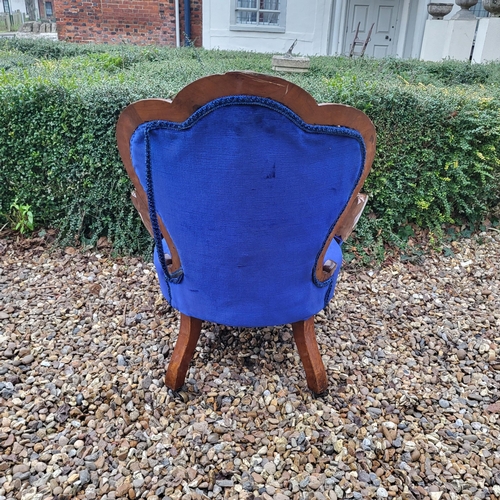 310 - A VICTORIAN MAHOGANY OPEN ARMCHAIR
With shell back overscroll carved and pieced arms, in royal blue ... 