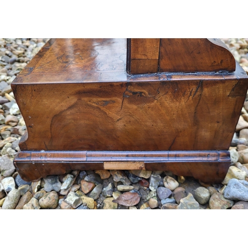 311 - AN 18TH CENTURY WALNUT TOILET MIRROR
With serpentine planished bevelled above three trinket drawers,... 