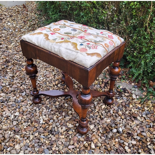 313 - AN 18TH/19TH CENTURY QUEEN ANNE STOOL
With crewel work cover, above solid apron, raised on four cup ... 