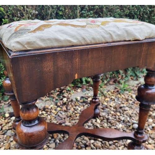 313 - AN 18TH/19TH CENTURY QUEEN ANNE STOOL
With crewel work cover, above solid apron, raised on four cup ... 