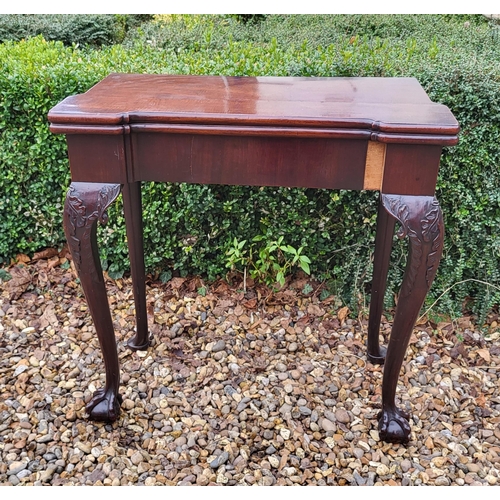 315 - AN 18TH CENTURY MAHOGANY FOLD OVER CARD TABLE
With inverted break front top, enclosing red baize sur... 