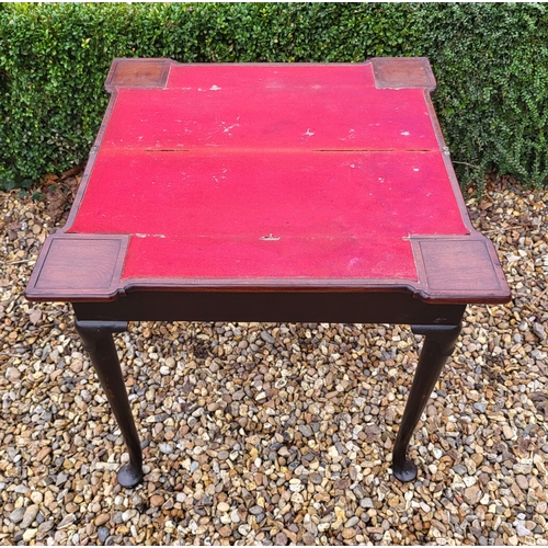 315 - AN 18TH CENTURY MAHOGANY FOLD OVER CARD TABLE
With inverted break front top, enclosing red baize sur... 