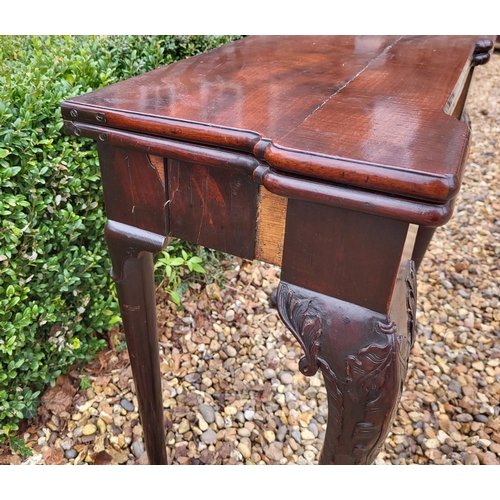 315 - AN 18TH CENTURY MAHOGANY FOLD OVER CARD TABLE
With inverted break front top, enclosing red baize sur... 