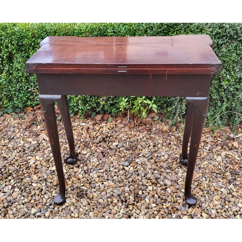 315 - AN 18TH CENTURY MAHOGANY FOLD OVER CARD TABLE
With inverted break front top, enclosing red baize sur... 