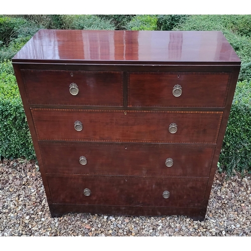 318 - A 19TH CENTURY MAHOGANY CHEST
With two short and three long drawers with brass handles, on bracket f... 