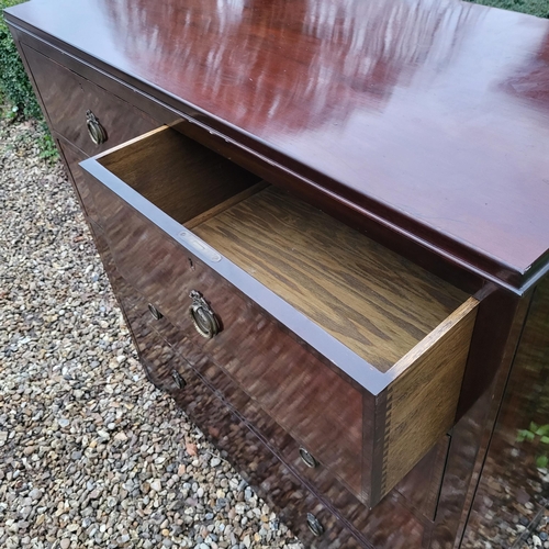 318 - A 19TH CENTURY MAHOGANY CHEST
With two short and three long drawers with brass handles, on bracket f... 