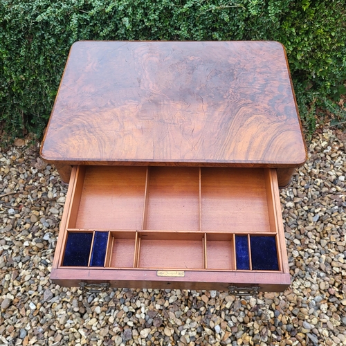 320 - A VICTORIAN WALNUT LADIES’ WORK TABLE
With single drawer and basket, on acanthus carved turned suppo... 