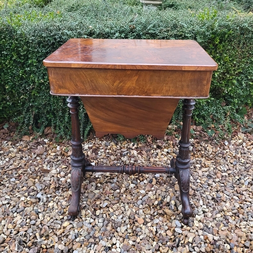 320 - A VICTORIAN WALNUT LADIES’ WORK TABLE
With single drawer and basket, on acanthus carved turned suppo... 