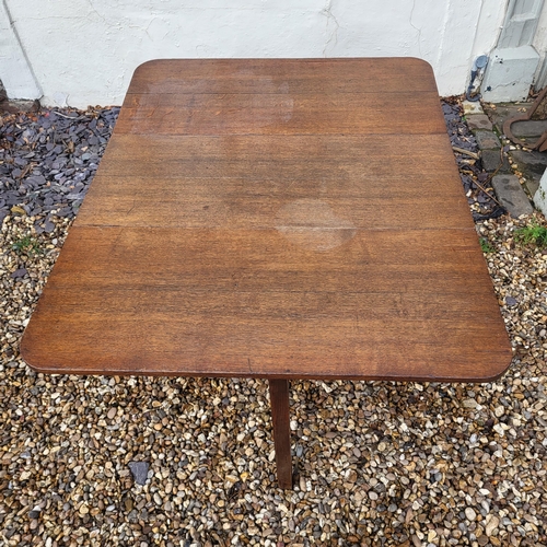 321 - A GEORGIAN SOLID MAHOGANY DROP LEAF DINING TABLE
Raised on turned legs with pad feet.
(103cm x 77cm ... 