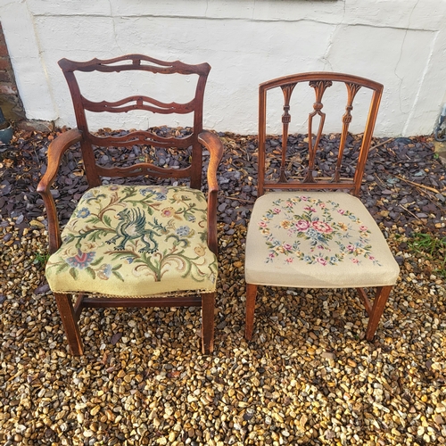 325 - A GEORGIAN MAHOGANY OPEN ARMCHAIR
With pierced ladder back and tapestry floral upholstered seat, cen... 