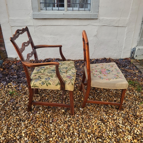 325 - A GEORGIAN MAHOGANY OPEN ARMCHAIR
With pierced ladder back and tapestry floral upholstered seat, cen... 