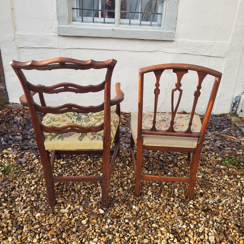 325 - A GEORGIAN MAHOGANY OPEN ARMCHAIR
With pierced ladder back and tapestry floral upholstered seat, cen... 