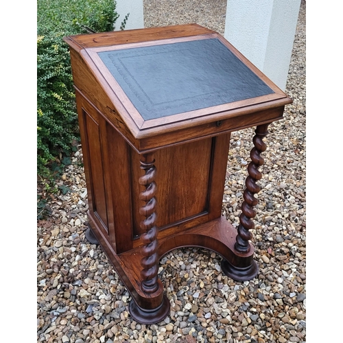 331 - A VICTORIAN ROSEWOOD DAVENPORT DESK
With leather surface, enclosing a fitted interior, with cupboard... 