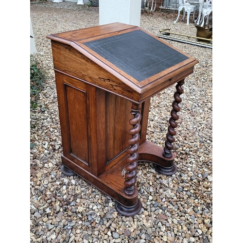 331 - A VICTORIAN ROSEWOOD DAVENPORT DESK
With leather surface, enclosing a fitted interior, with cupboard... 