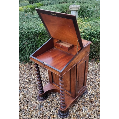 331 - A VICTORIAN ROSEWOOD DAVENPORT DESK
With leather surface, enclosing a fitted interior, with cupboard... 