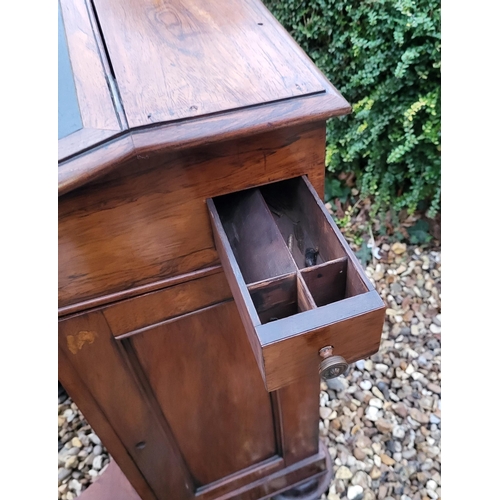 331 - A VICTORIAN ROSEWOOD DAVENPORT DESK
With leather surface, enclosing a fitted interior, with cupboard... 